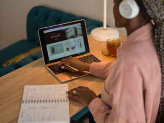 Woman shopping online on laptop