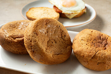 A view of a pile of dairy-free, gluten-free English muffins.