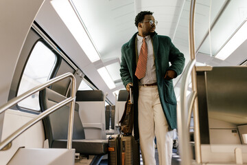 Businessman Traveling with Luggage Inside a Modern Train Interior