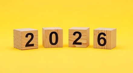 Wooden Blocks Forming 2026 Against Bright Yellow Background