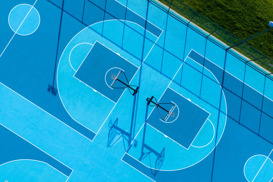 outdoor basketball court aerial view with blue surface