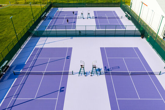 tennis court aerial view with purple surface in free public area