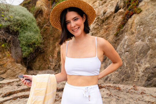 smiling woman enjoys beach vacation