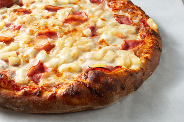 A view of a Hawaiian pizza.