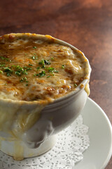 A closeup view of a bowl of French onion soup.