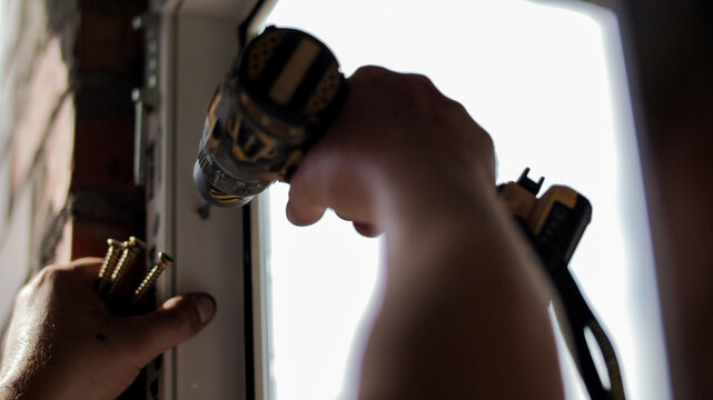 Installation of window frame with screwdriver