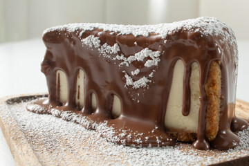 A closeup view of a chocolate melt cheesecake slice.