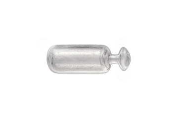 Empty transparent glass decanter lying on side