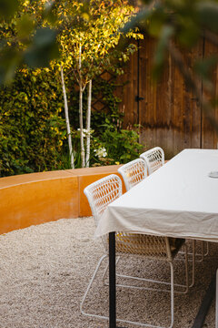 Family-Friendly Garden with Tiered Planting and Cozy Patio
