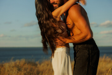 Smiling Lovers Enjoy Dancing By The Sea