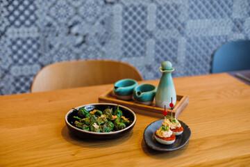 Dishes of Spanish appetizers arranged on a table in a restaurant