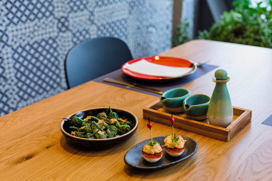 Dishes of Spanish appetizers arranged on a table in a restaurant