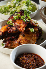 A view of garlic mala chicken with some sides.