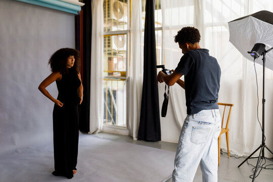Model Poses in Studio During a Photoshoot 