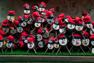Christmas market: traditional souvenirs and Tío de Nadal figurines for sale to tourists. Log