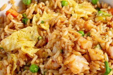 A top down view of a bowl of shrimp fried rice, as a background.