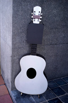 Unique Guitar Decoration With a Heart Design in a City Street
