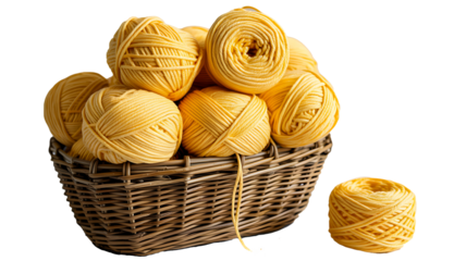 Yellow yarn balls in woven basket with separate roll on white background for knitting and craft  
