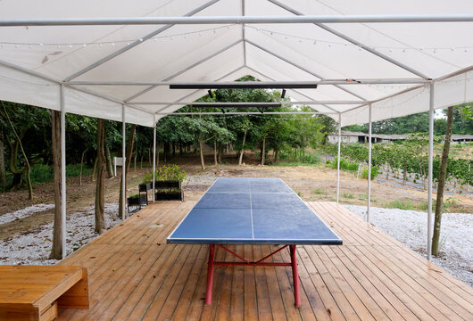 A large shaded entertainment area in the forest