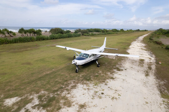 Small Airplane at Remote Coastal Airstrip