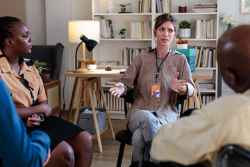 Therapist guiding a group therapy session
