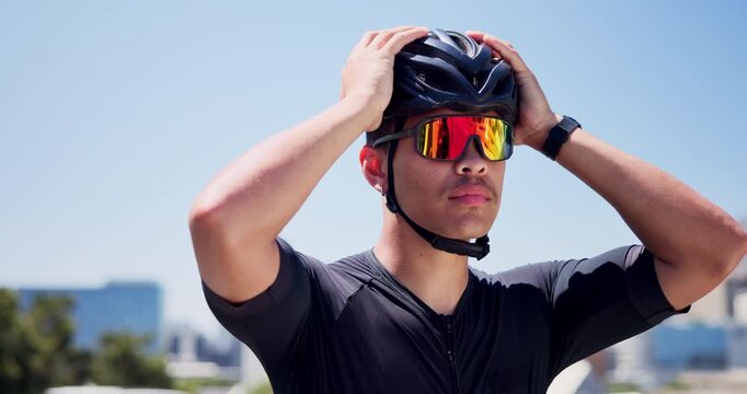 Man, helmet and start cycling in city, sunglasses and outdoor for training, fitness or ready in street. Person, smile and safety gear for ride, exercise or cyclist with space on bridge in urban town