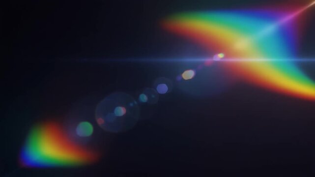 Abstract rainbow light dispersion with colorful spectral flares and lens leak effects on a dark background.