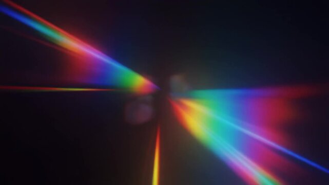 Abstract rainbow light dispersion with colorful spectral flares and lens leak effects on a dark background.