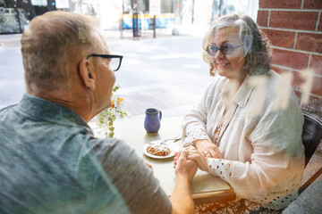 Senior couple enjoying outdoor cafe
