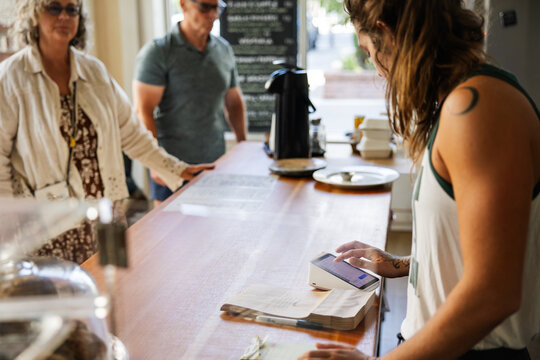 Customers ordering at a cozy cafe
