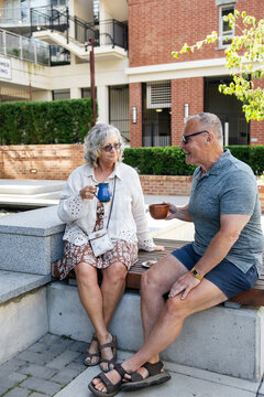 Senior couple enjoying outdoor coffee