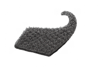 Abstract textured dark stone fragment with curved shape