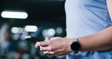 Hands, phone and person in gym for fitness, training information or check stats. Mobile, sports club and athlete typing for online communication, text app and tracking workout for health with bokeh - Powered by Adobe