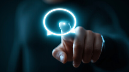 A person is pointing at a blue circle on a screen