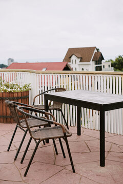 Outdoor dining area with a view of rooftops