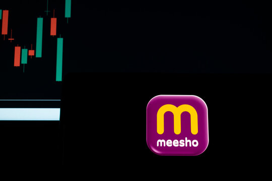Meesho logo over stock-market chart evokes e-commerce startup spirit, highlighting business growth, IPO potential, investor interest, profit opportunity and risk of loss in finance and trading Markets