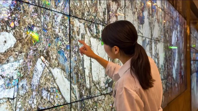Technician examining structural flaws through AIbased imaging on a screen highlighting internal material inconsistencies in real time.