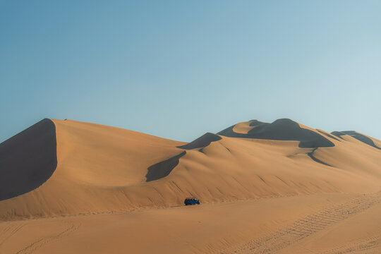 Buggy on sand dunes in the desert  