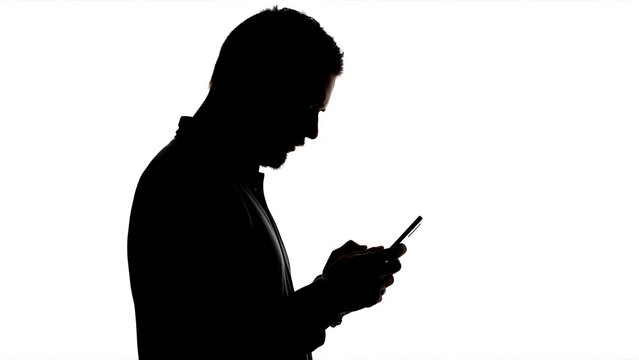 Silhouette of man holding phone on white background