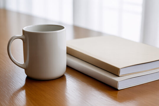 Relaxing morning coffee break with books on a wooden desk