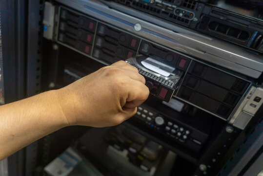 Hand Inserting Data Storage Device In Rack