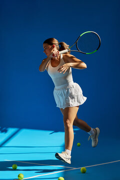 Tennis player in action during a practice session indoors