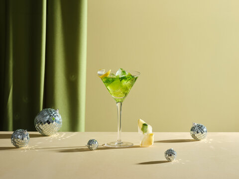 Festive cocktail with disco balls, perfect for celebratory holiday