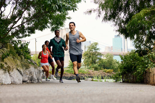 Group of athletes running in the park