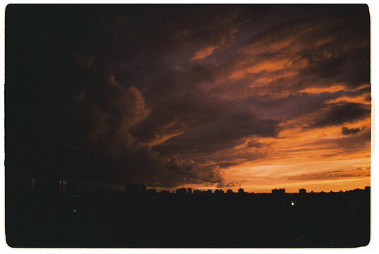 Fototapeta view from the window on the 14th floor of a sunset