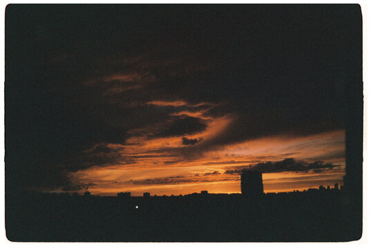 Fototapeta view from the window on the 14th floor of a sunset