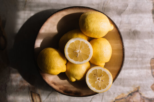 Fresh lemons in a rustic plate