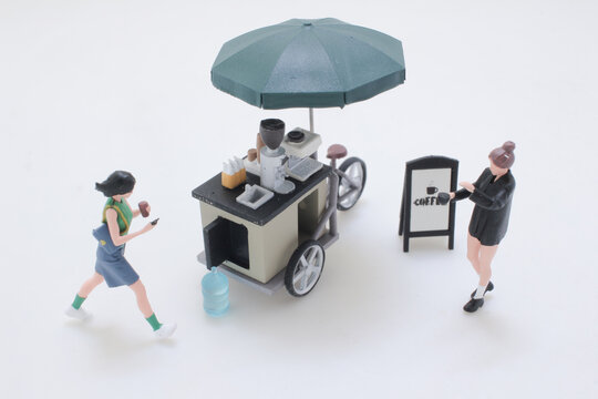 Mini Coffee Cart With Umbrella and Playful Miniature Figures in Street Scene