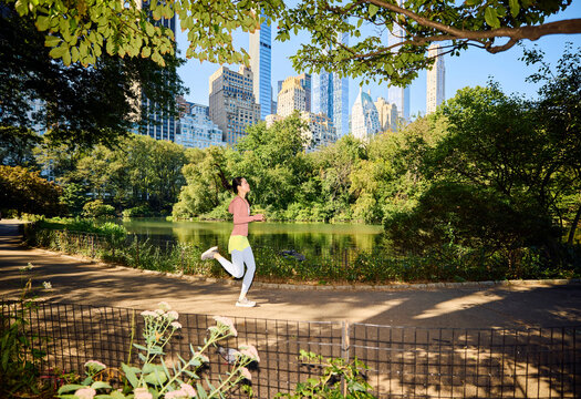 Woman runs through the park