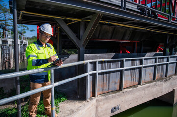 A specialist engineer is inspecting the overall operation of a wastewater treatment plant.